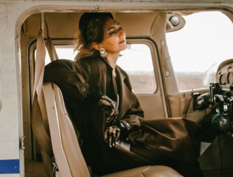 woman pilot smart dress old plane